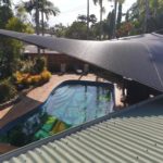 Grey shades over swimming pool — Shade Sails in Edmonton, QLD